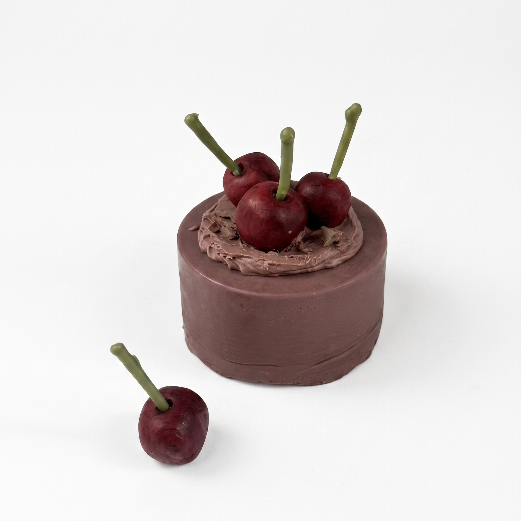 SORA SCENT Mini Chocolate Cherry Cake Candle on a clean background, showcasing its cocoa brown smooth cylinder base, chocolate ganache frosting, and detailed wax cherries with delicate stems.