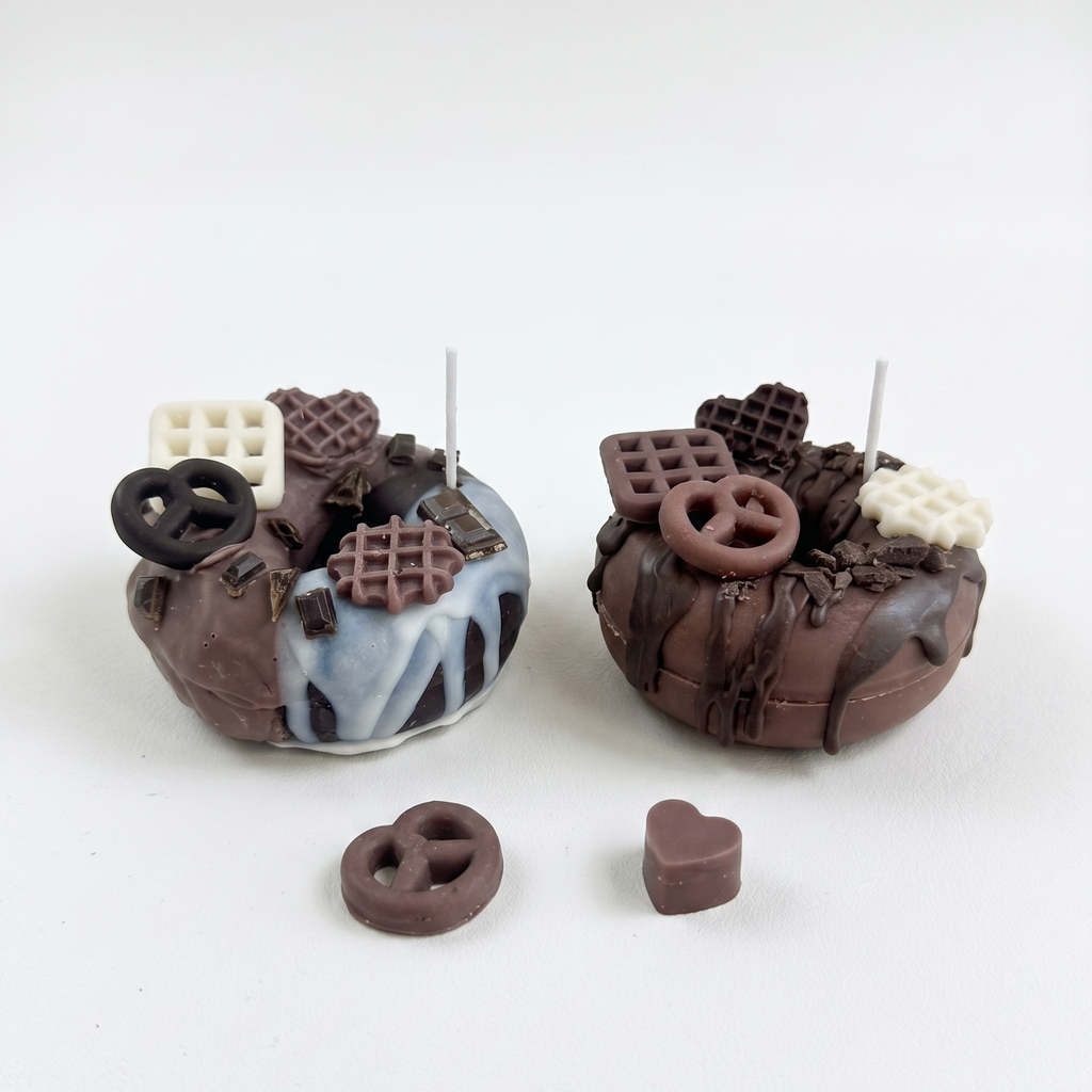 SORA SCENT Mini Chocolate Glazed Donut Candle on a clean background, showcasing its cocoa brown donut base, glossy dripping wax glaze, and detailed miniature pretzel and waffle toppers.